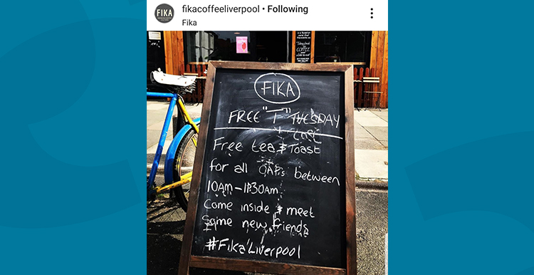 Screenshot of an Instagram post showing the chalk board outside FIKA cafe inviting people in for 'Free T Tuesday'