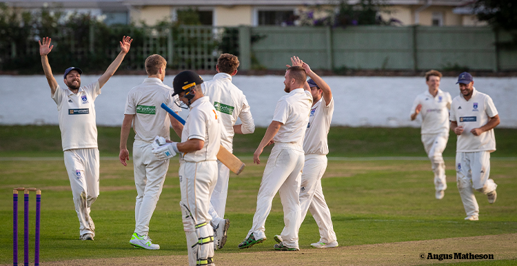 Andrew's cricket teams celebrating a wicket