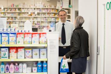 Person collecting prescription at Pharmacy