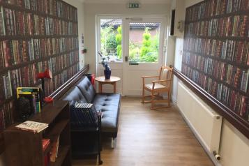 image of an area of a care home decorated as a library