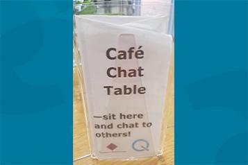 Image of the cafe chat table sign in the Friends Meeting House on School Lane