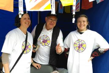 three people wearing liverpool mental health festival t-shirts