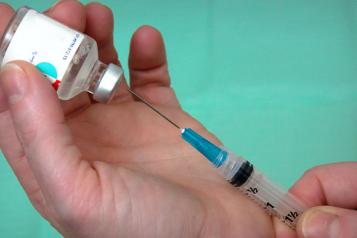 image of needle and vaccine